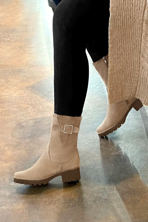 French elegance and refinement for these tan beige dress booties, with buckles on the sides, 
                available in many subtle leather and colour combinations. This high boot with its lateral zip will allow you to put a pair of jeans inside.
Its comfortable sole will make you spend the winter in comfort.  
                Matching clutches for parties, ceremonies and weddings.   
                You can customize these buckle ankle boots to perfectly match your tastes or needs, and have a unique model.  
                Choice of leathers, colours, knots and heels. 
                Wide range of materials and shades carefully chosen.  
                Rich collection of flat, low, mid and high heels.  
                Small and large shoe sizes - Florence KOOIJMAN